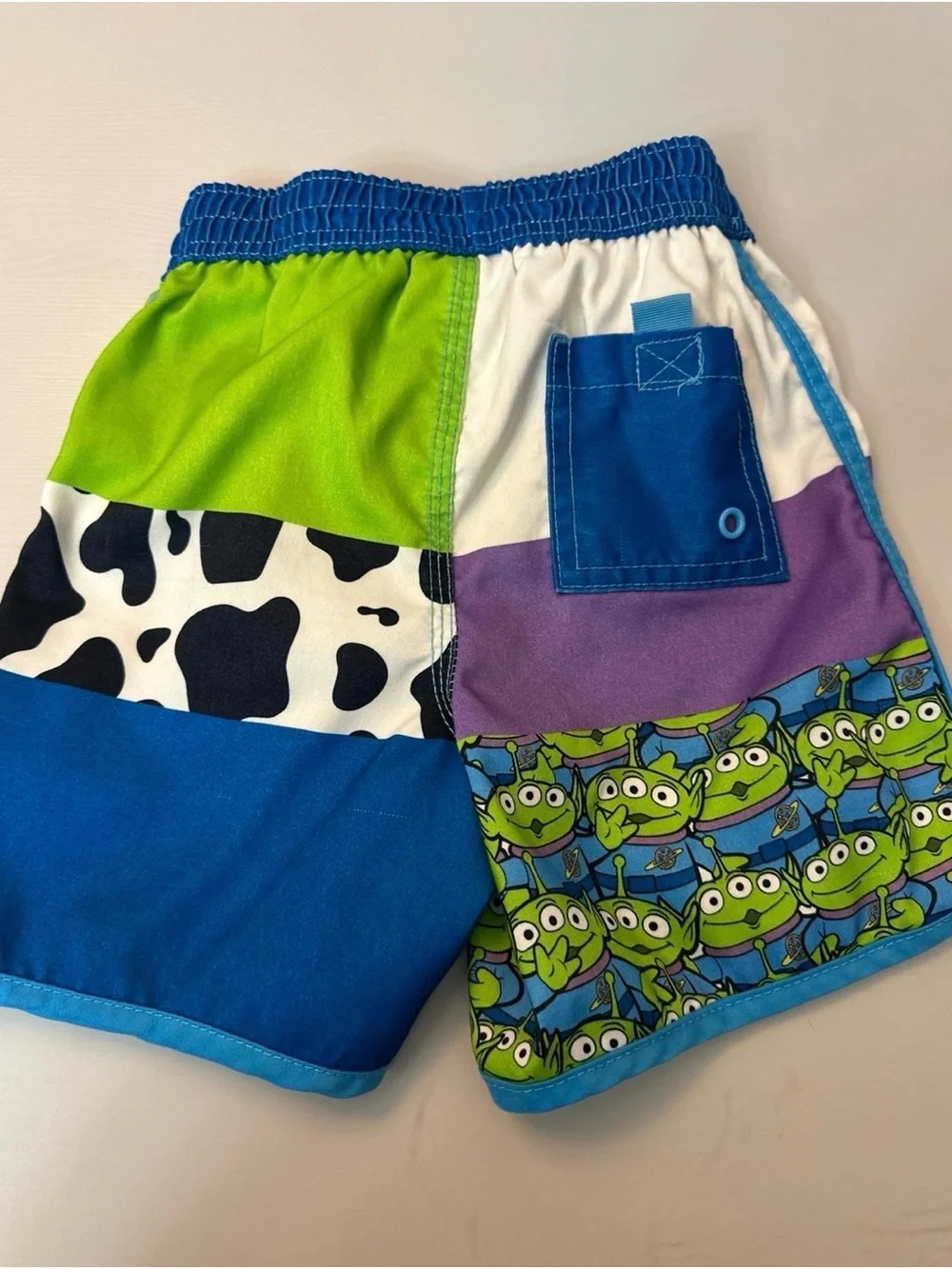 Disney Toy Story Patchwork Swim Shorts in Blue, Green & Purple